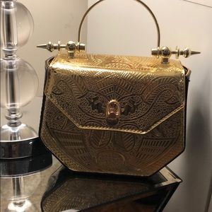 Fashion forward gold and black purse